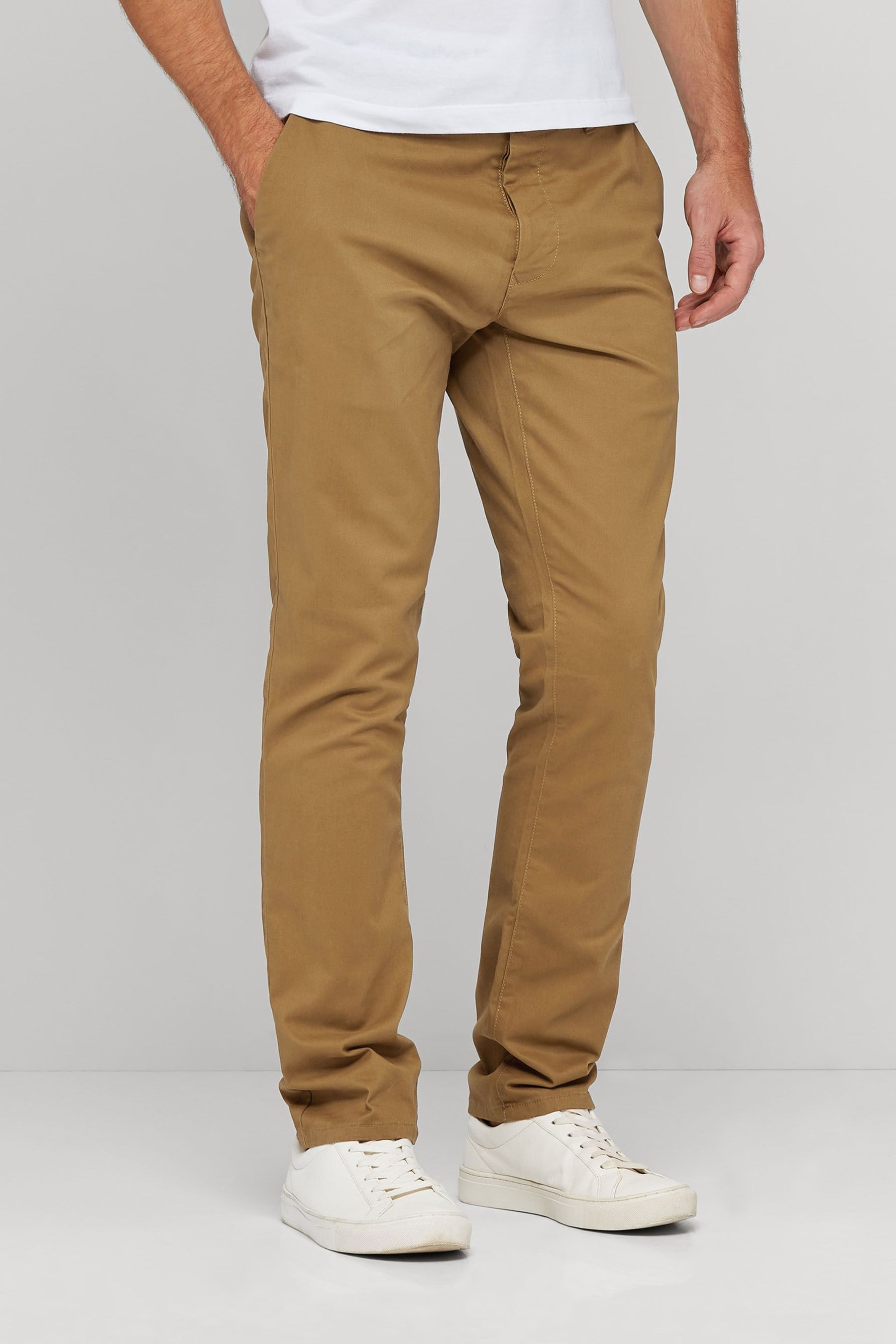 Complete This Look Shop Banana Republic's Aiden Slim Rapid Movement Chino: Rapid Movement Chinos: Tailored performance chinos designed to do more. Engineered with stretch for a comfortable fit that keeps its shape, with added water and stain resistant properties.,Front coin and off-seam pockets. Rear buttoned welt pockets.,Zip fly with hook-and-bar closure.,Belt loops.